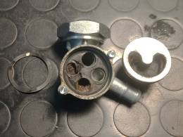 Debris inside and damaged gasket